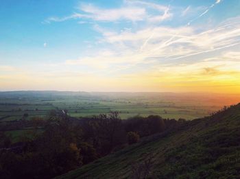 Scenic view of landscape against sky during sunset