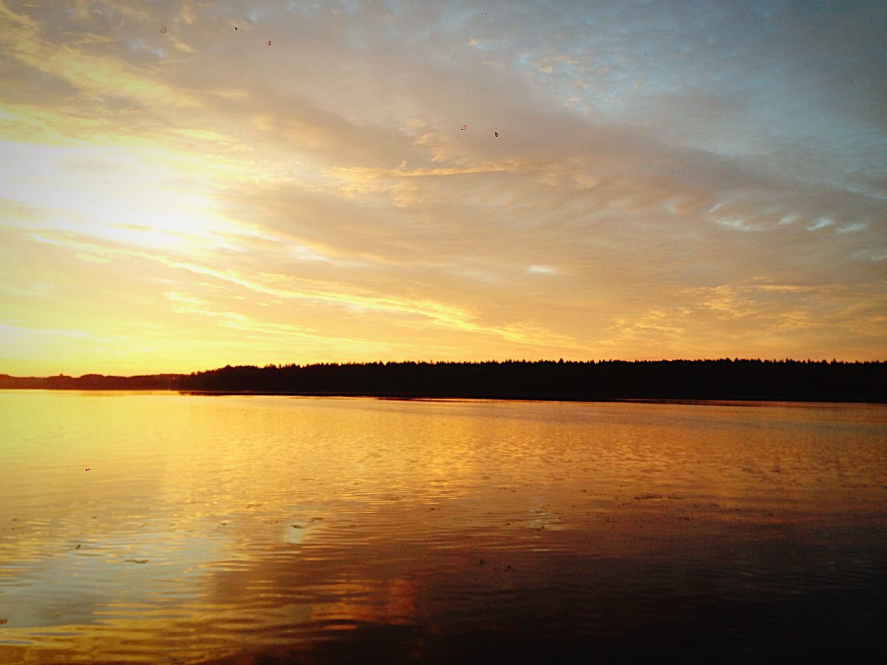 sunset, water, tranquil scene, tranquility, scenics, sky, beauty in nature, reflection, nature, idyllic, silhouette, orange color, lake, cloud - sky, waterfront, sun, river, cloud, rippled, outdoors