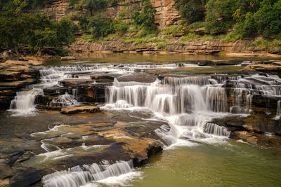 Scenic view of waterfall in forest