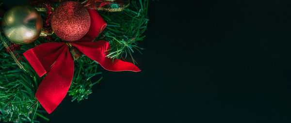 Christmas decorations over black background