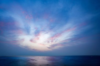 Scenic view of sea against blue sky