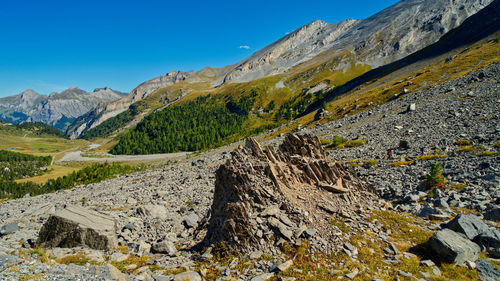 Scenic view of mountains against clear blue sky