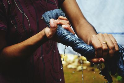 Close-up of man working in water