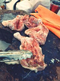 High angle view of meat on barbecue grill