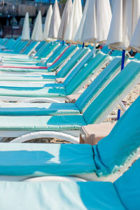 Close-up of chairs in swimming pool