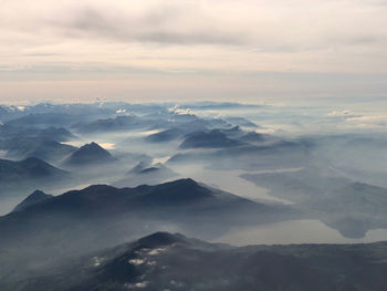 Aerial view of mountains against sky during sunset