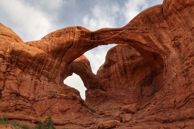 Low angle view of double arch in utah
