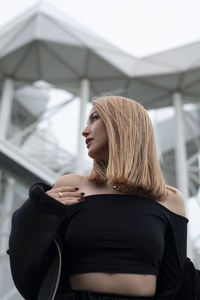 Young woman sitting outdoors