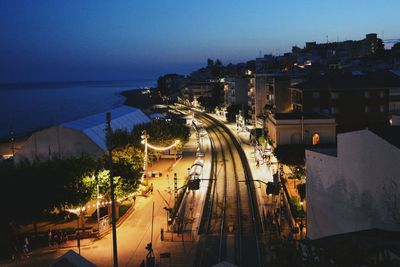 High angle view of light trails on road at night