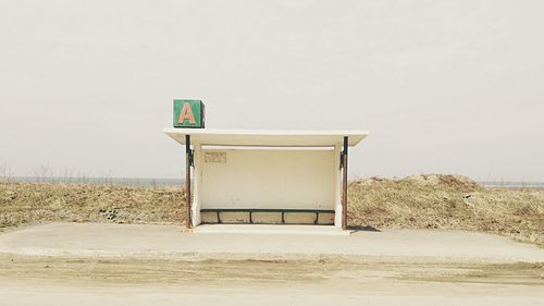 Empty bus stop at roadside