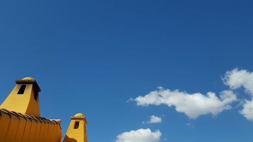 Low angle view of built structure against blue sky