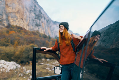 Young woman standing on mountain