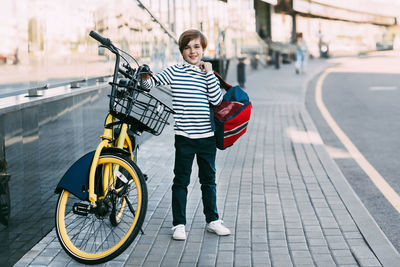 Portrait of boy cycling bicycle