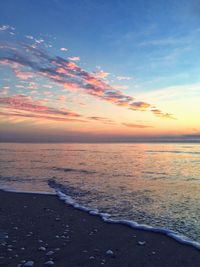 Scenic view of sea shore at sunset