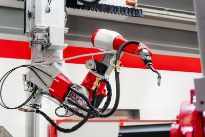 Close-up of welding robotic arm in factory