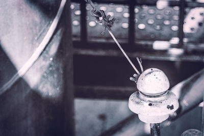 Close-up of rope tied on railing