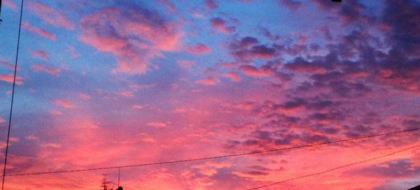 Low angle view of cloudy sky at sunset