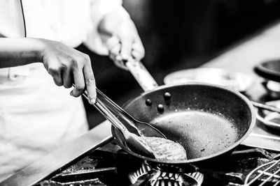 Close-up of man preparing food