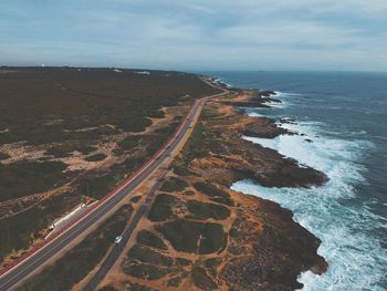 High angle view of road by sea against sky