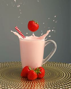 Close-up of strawberries in glass on table