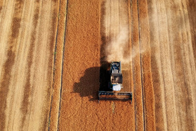 High angle view of combine harvester on field