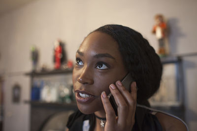 Close up of young woman talking on smartphone