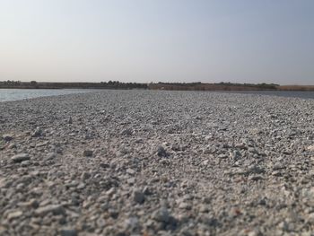 Surface level of land against clear sky