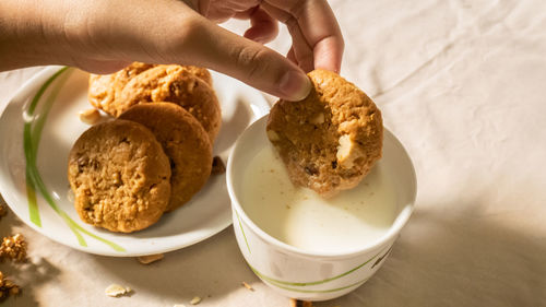 Midsection of person holding breakfast