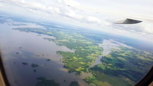 Cropped image of airplane flying over landscape