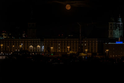 Illuminated buildings in city at night