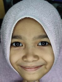 Close-up portrait of smiling girl