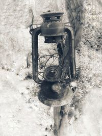 Close-up of old machine part on snow