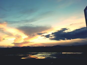 Scenic view of cloudy sky at sunset