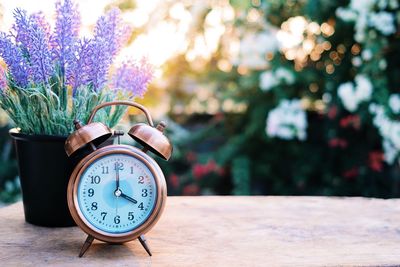 Close-up of clock on table