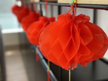 Close-up of red lanterns hanging outdoors