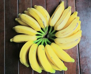 High angle view of yellow fruit on wood