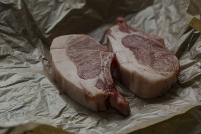 Close-up of meat and vegetables on cutting board