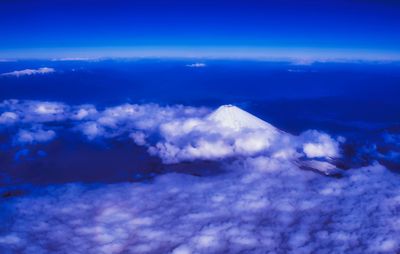 Aerial view of clouds over mountain