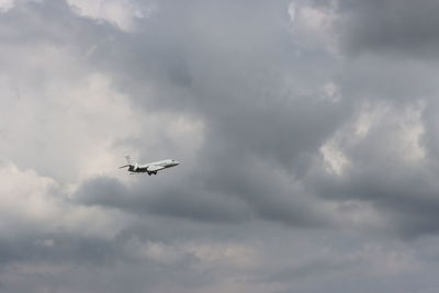 Low angle view of airplane flying in sky