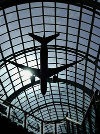 Low angle view of silhouette sculpture on ceiling