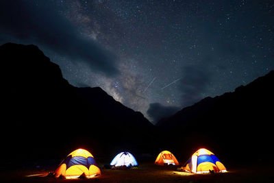 Scenic view of mountains against sky at night