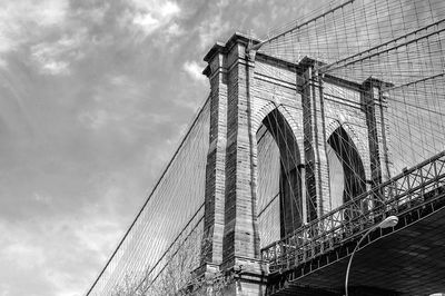 Low angle view of brooklyn bridge against sky