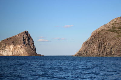 Scenic view of sea against blue sky