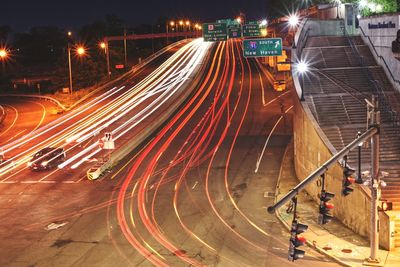 High angle view of light trails on road at night