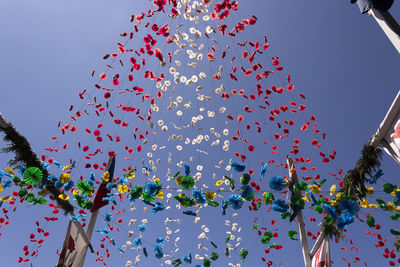 Low angle view of tree against blue sky