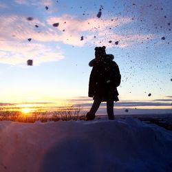 View of woman at sunset