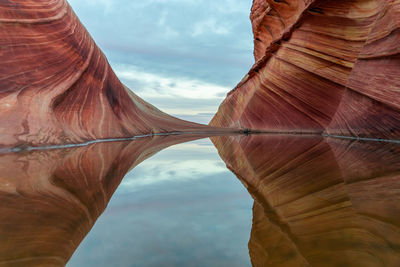 Directly below shot of rock formation against sky