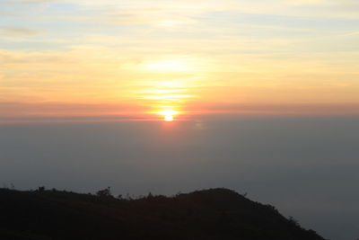 Scenic view of mountains at sunset