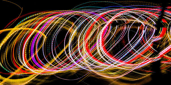 Light trails against sky at night