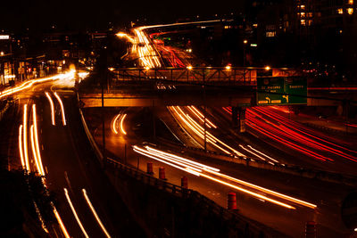 Blurred vehicle lights on i-405 at night.